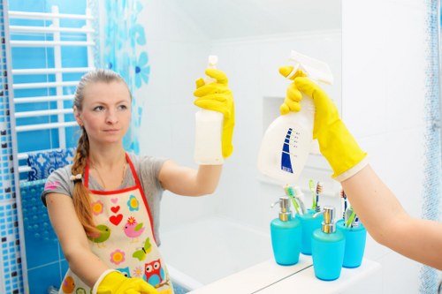Carpet cleaning technician preparing safe equipment in a home